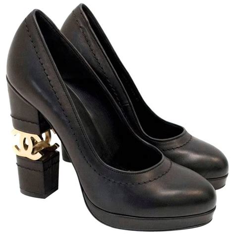 chanel cc toe black gold pump|Chanel pumps.